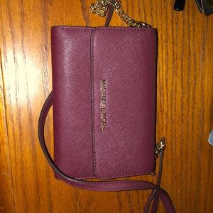 Burgundy Michael Kors wallet with chain